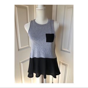 Sheer peplum, jersey knit sleeveless top